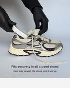 A white, gray, and black athletic sneaker with a heel-only design being demonstrated with a white Öndörq Elevate Invisible height Insole for men inserted into the toe area, shown on a light blue background with text stating 'Fits securely in all closed shoes' and 'Heel only design fits shoes size 5 and up'.