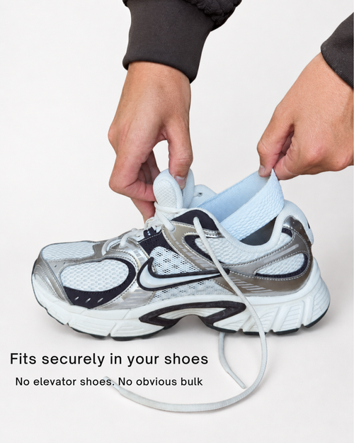ondorq elevate height boosting insole for men being inserted into shoe